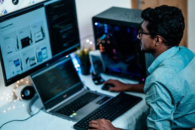 An employee at his desk during one of his work from home jobs.