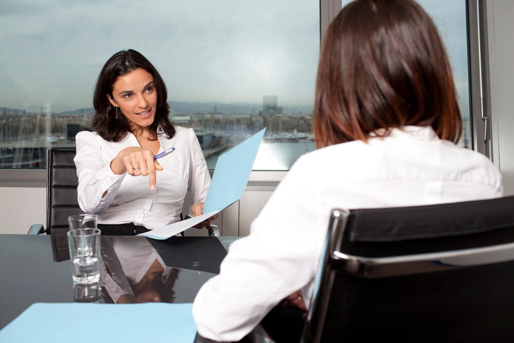 HR manager asking interviewee about her last boss during a second interview