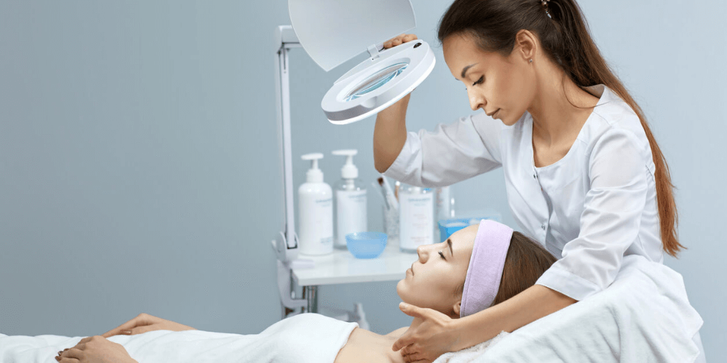 Professional treating a customer in cosmetology.