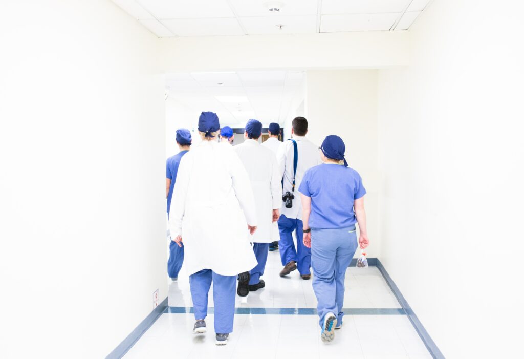 Healthcare professionals walking away in the hospital